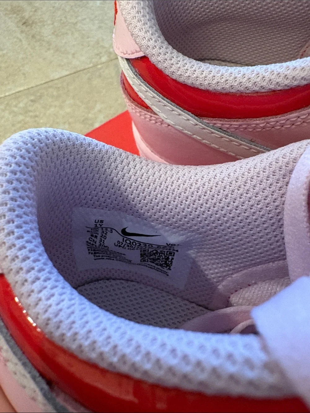 Nike Kids Pink and Red Low-Top Sneakers with White Swoosh